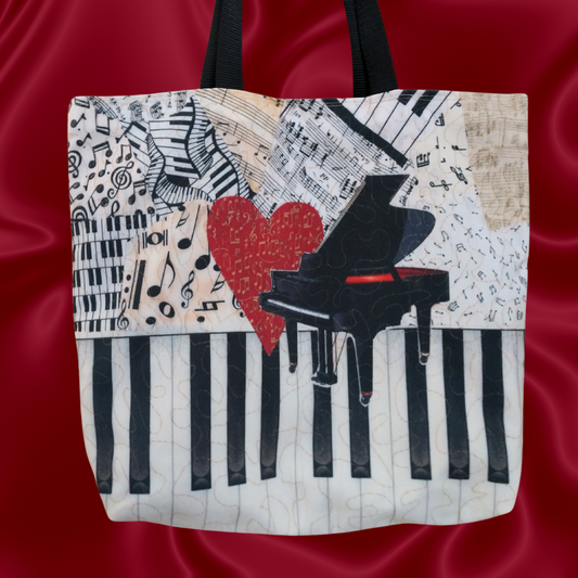 Handmade tote bag with a reproduction of original music-themed fiber art by Loretta Alvarado