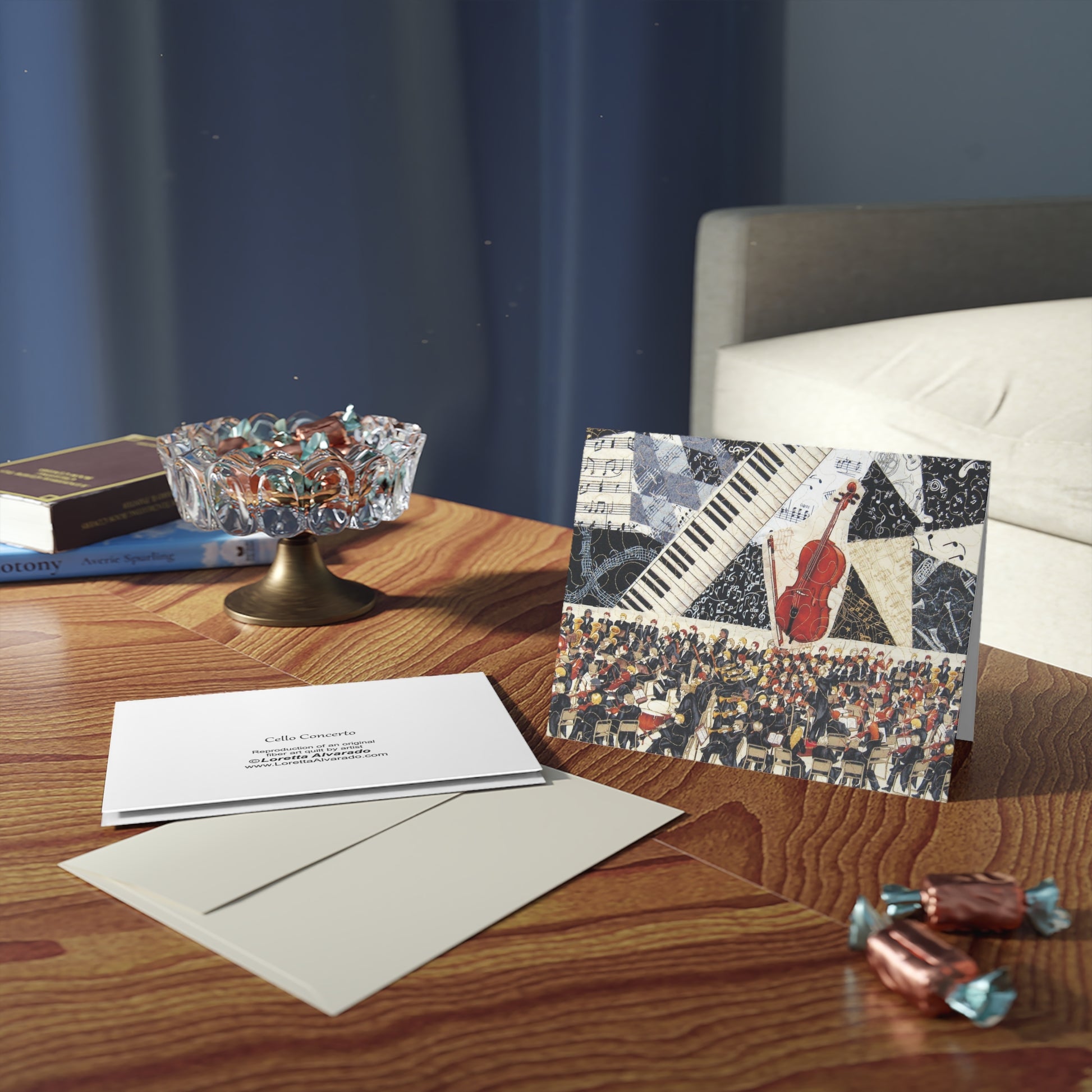 Greeting card with musical design on a wooden table with envelopes and candies.